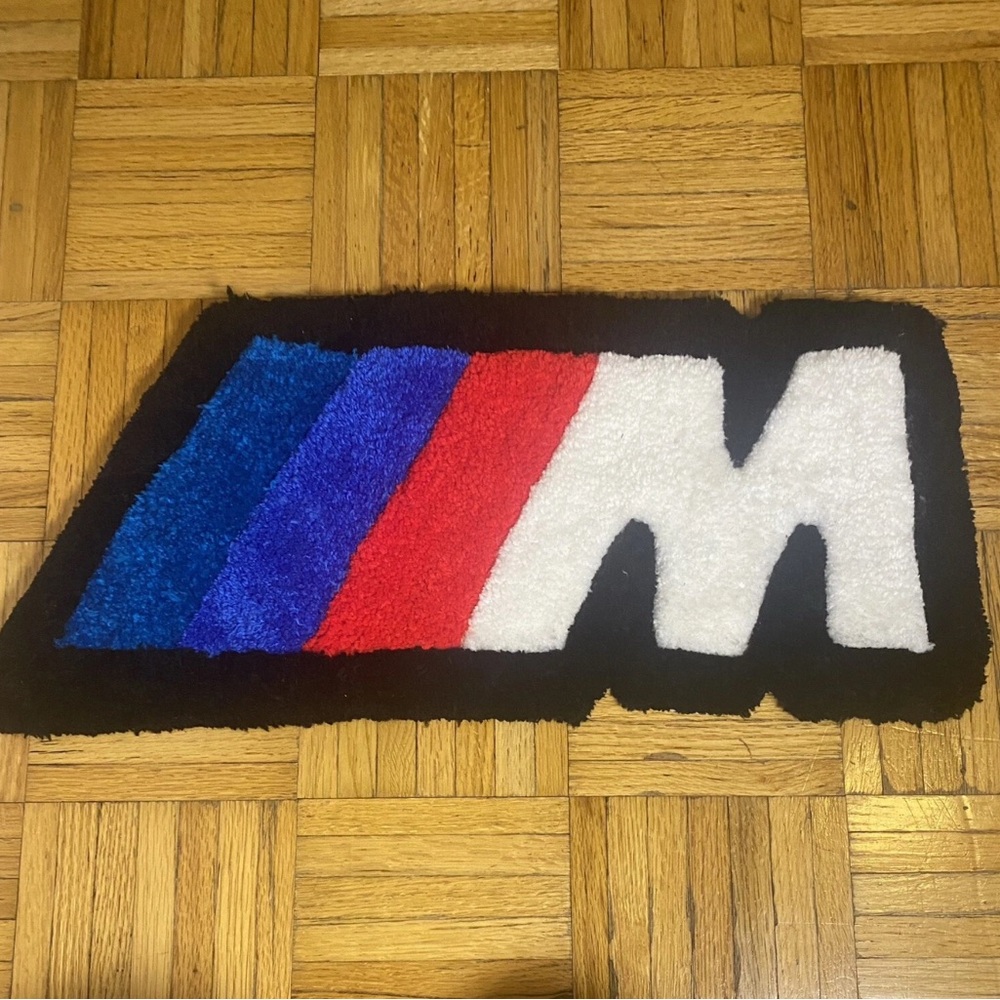 Custom racing stripe-inspired rug in bold blue, red, and white